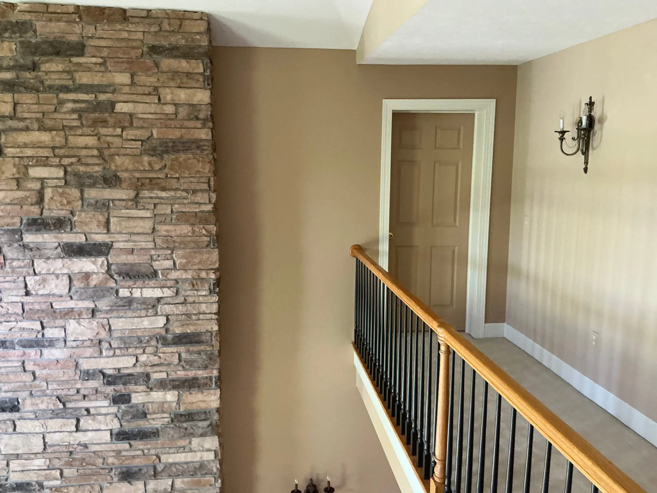 freshly painted living room with neutral tan walls in Buffalo home