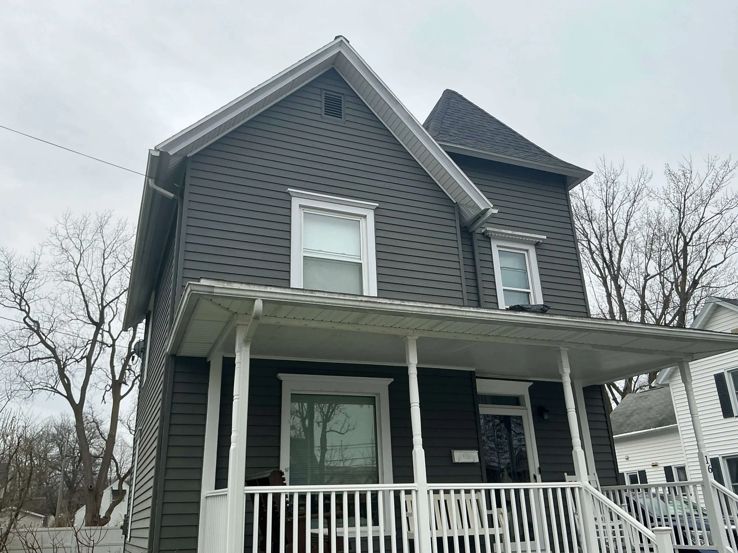 two story Buffalo house painted light gray exterior