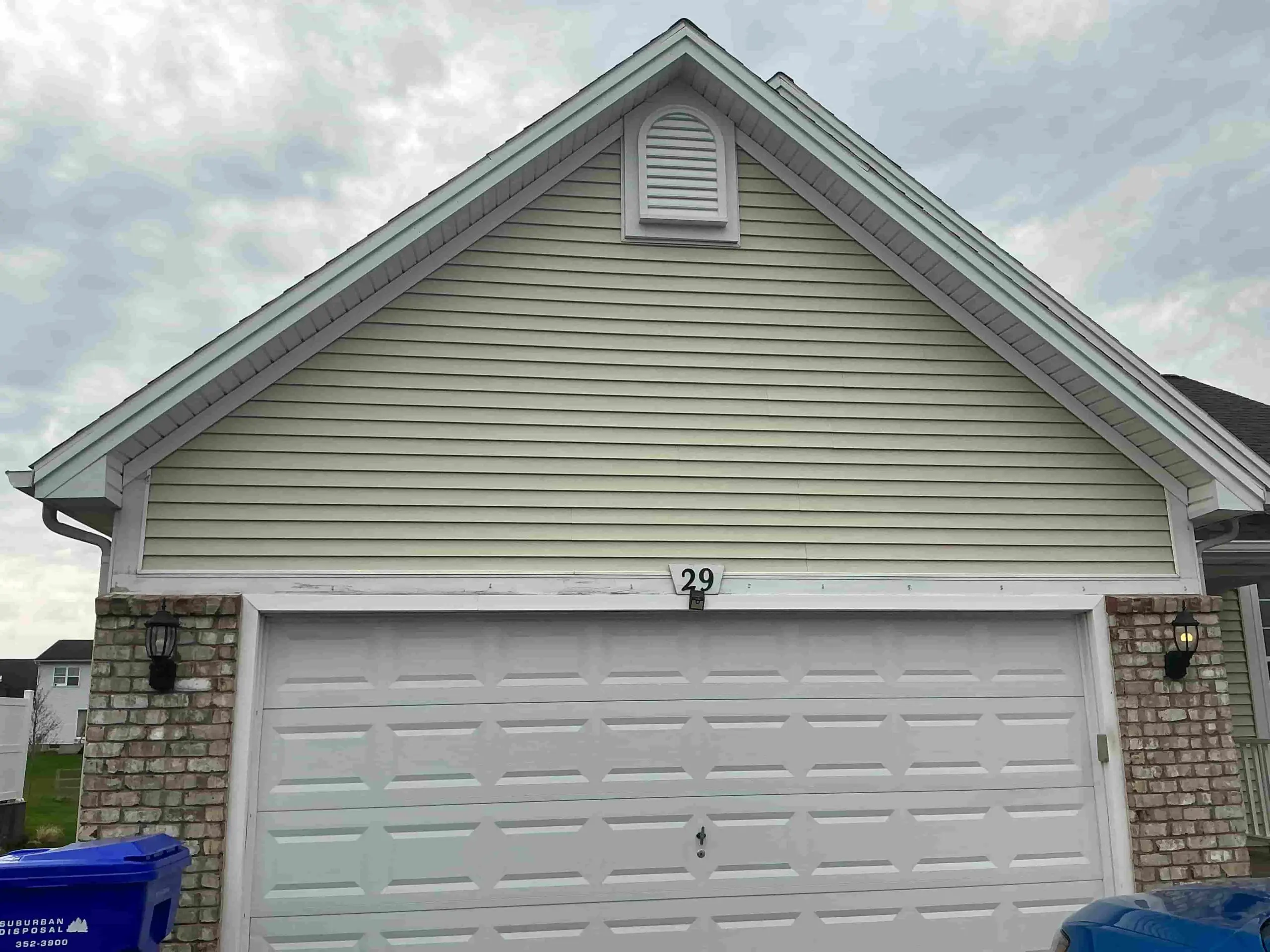 freshly painted siding on Rochester suburban home