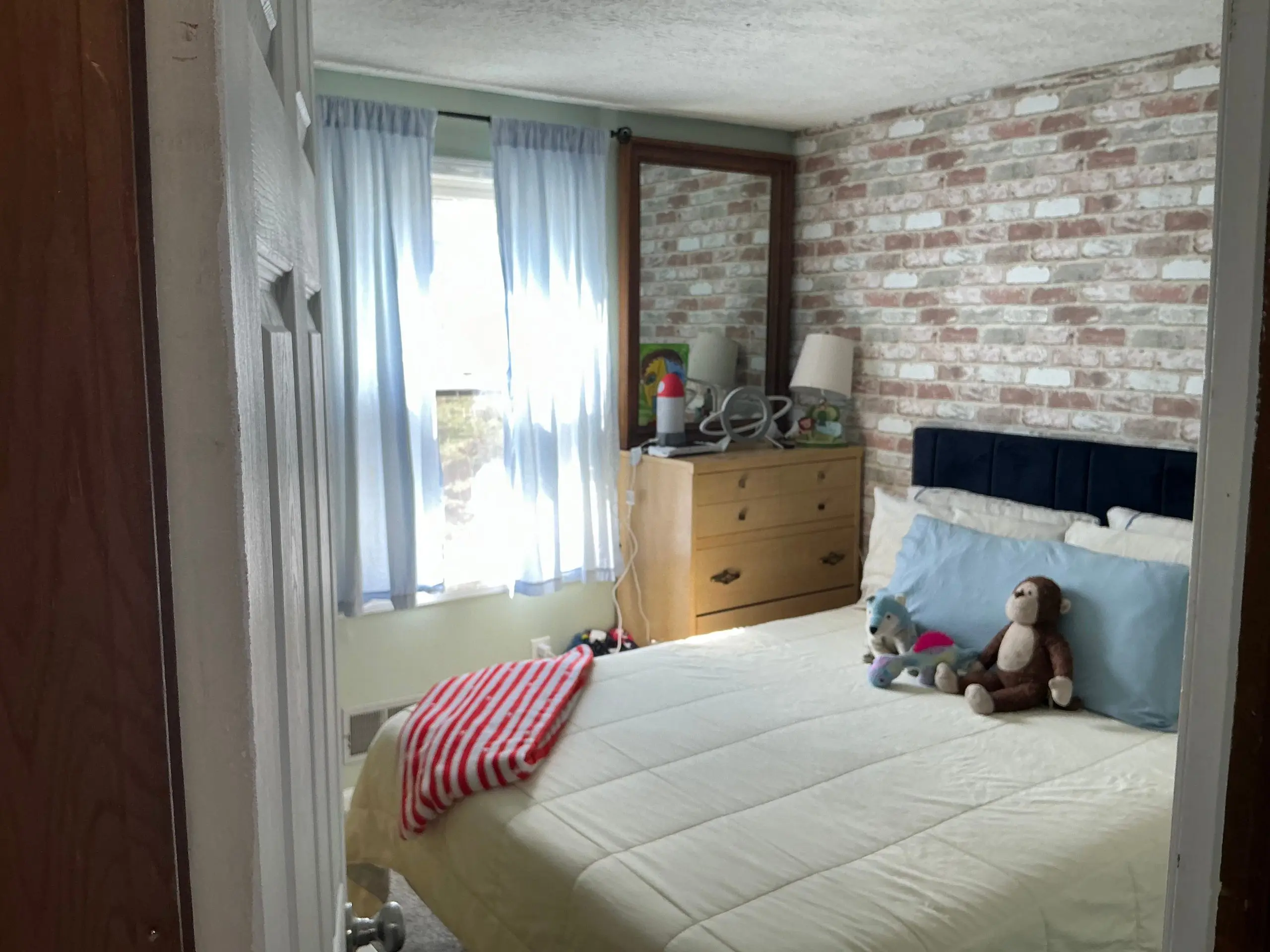 bedroom walls painted light grey in Rochester home