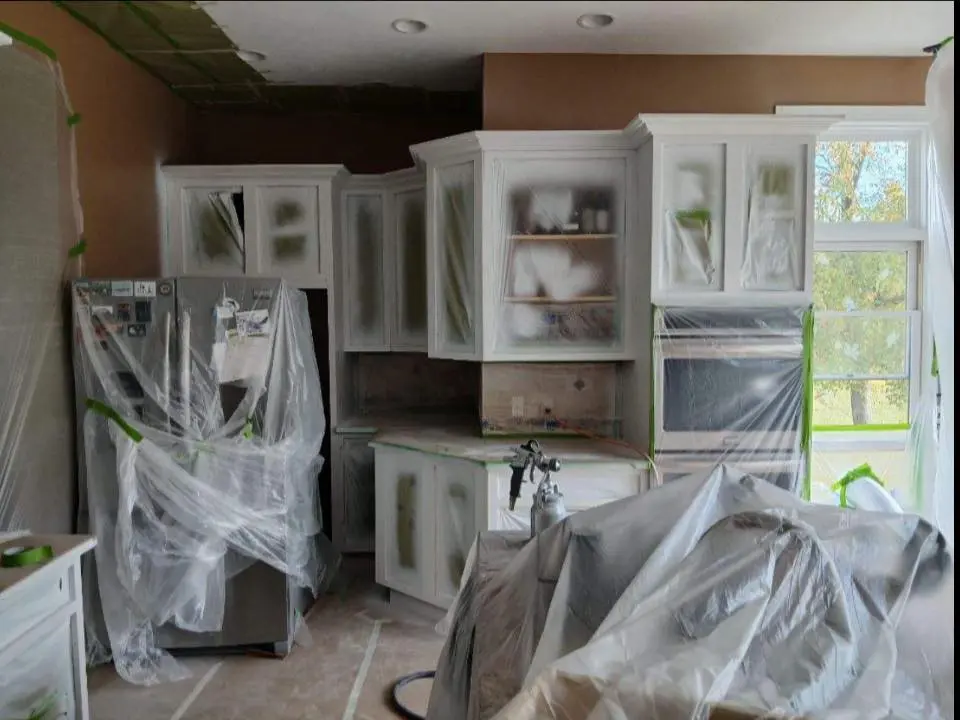 white kitchen cabinets professionally stained in Buffalo home