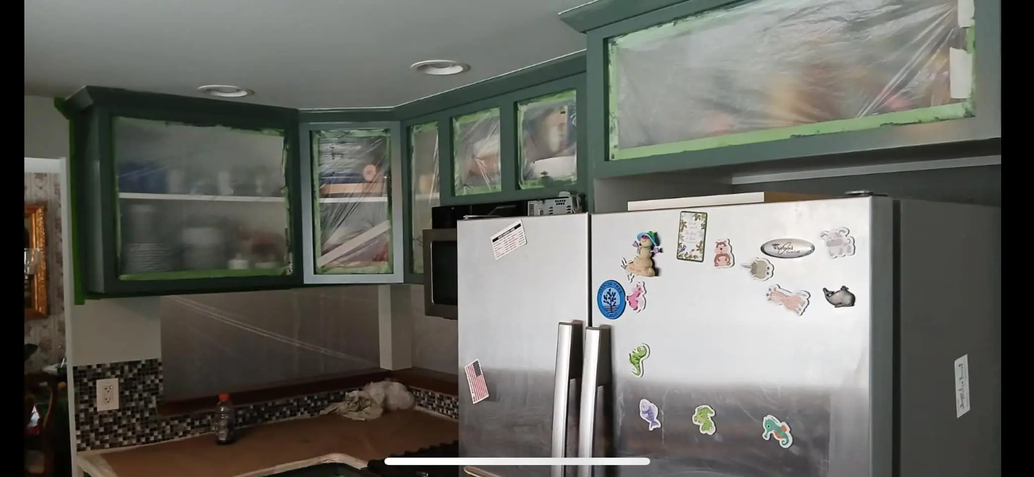 outdated cabinets freshly painted pine green in Rochester