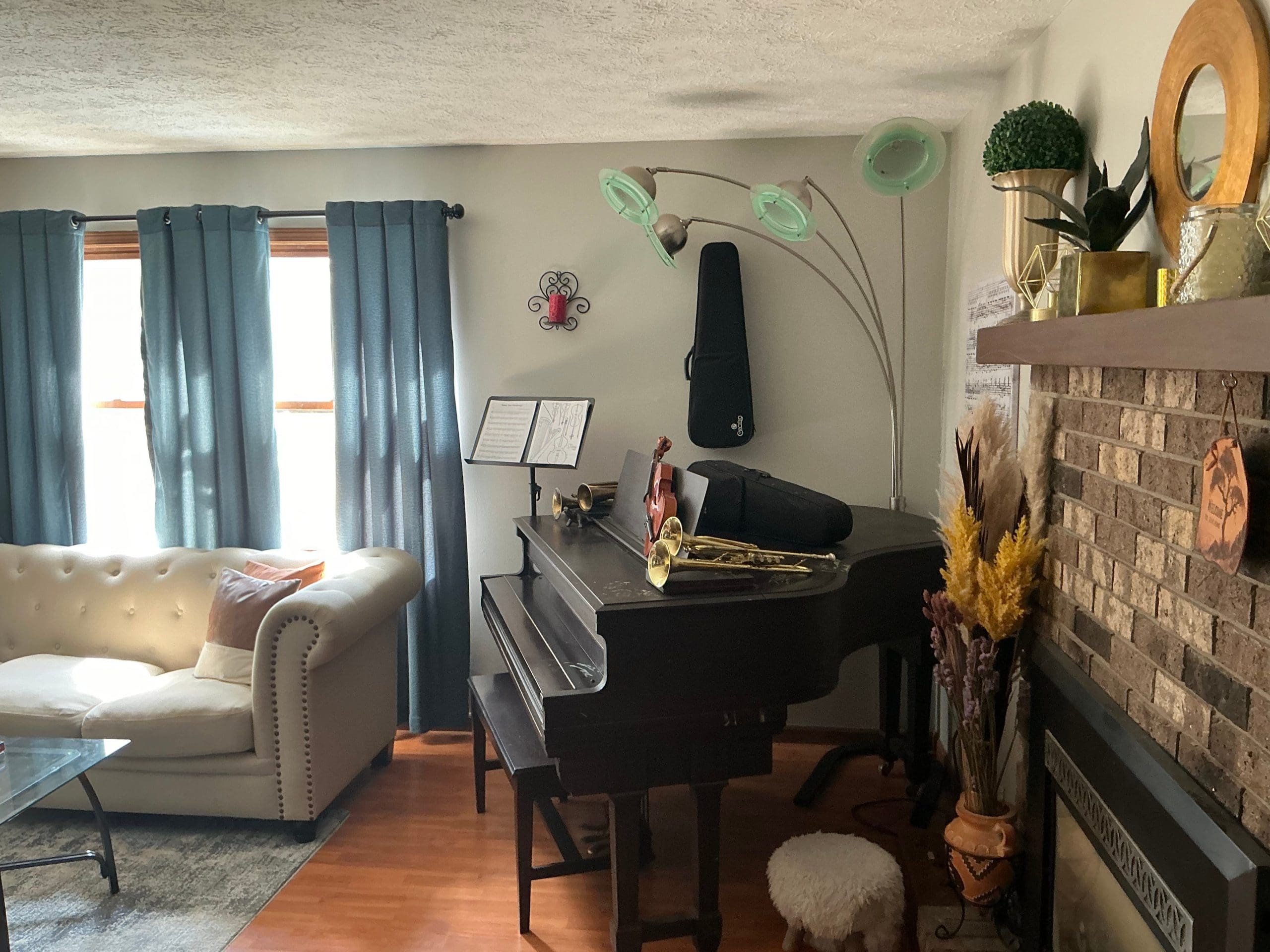 freshly painted room with neutral walls and piano in Buffalo home