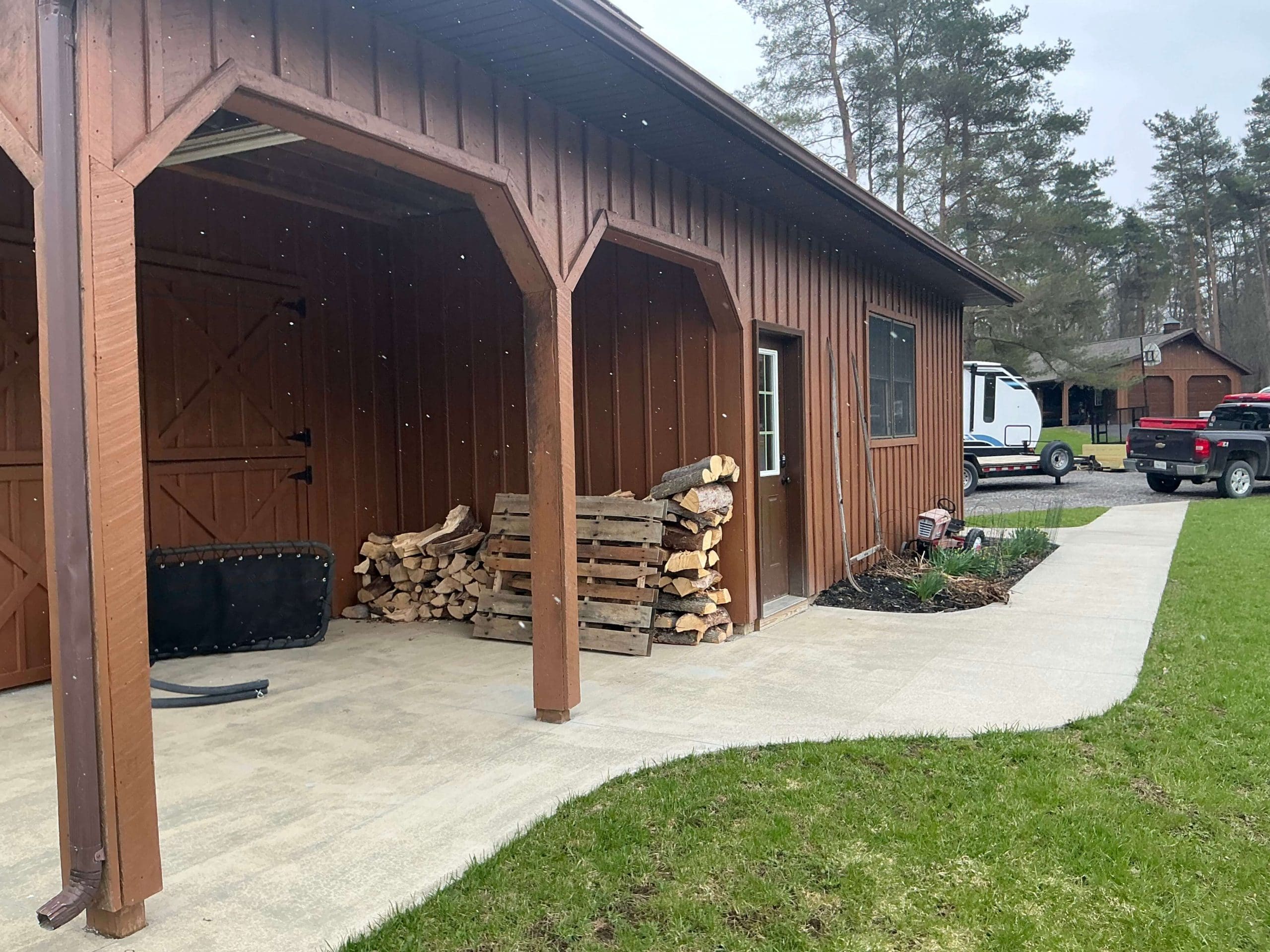 stained wood deck and siding in Buffalo backyard