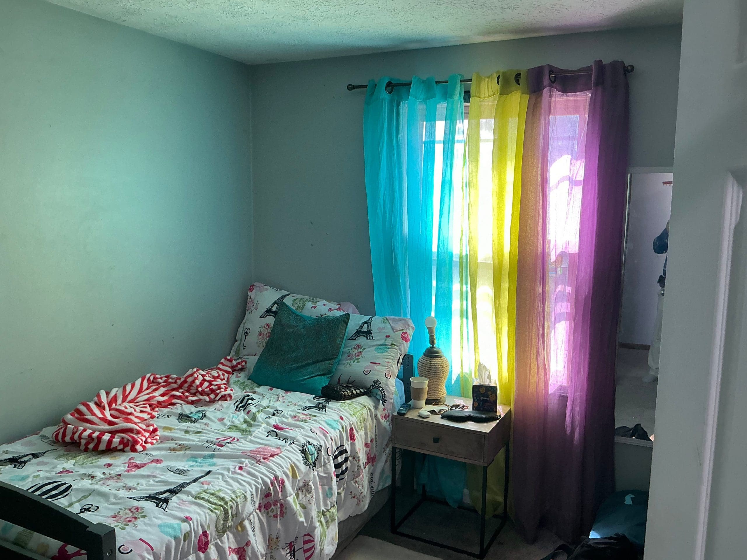bedroom walls painted blue in Rochester home