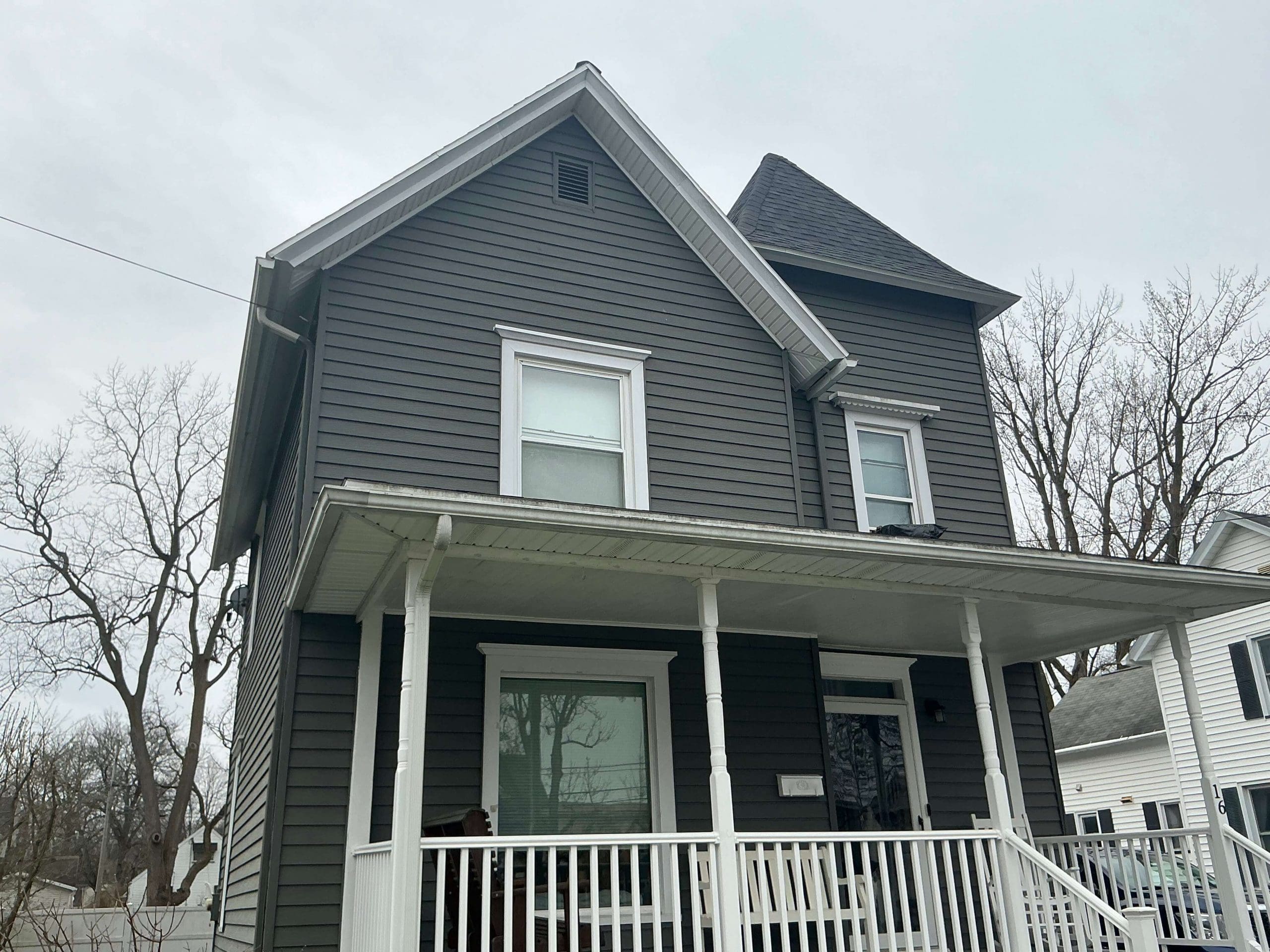 two story Buffalo house painted light gray exterior