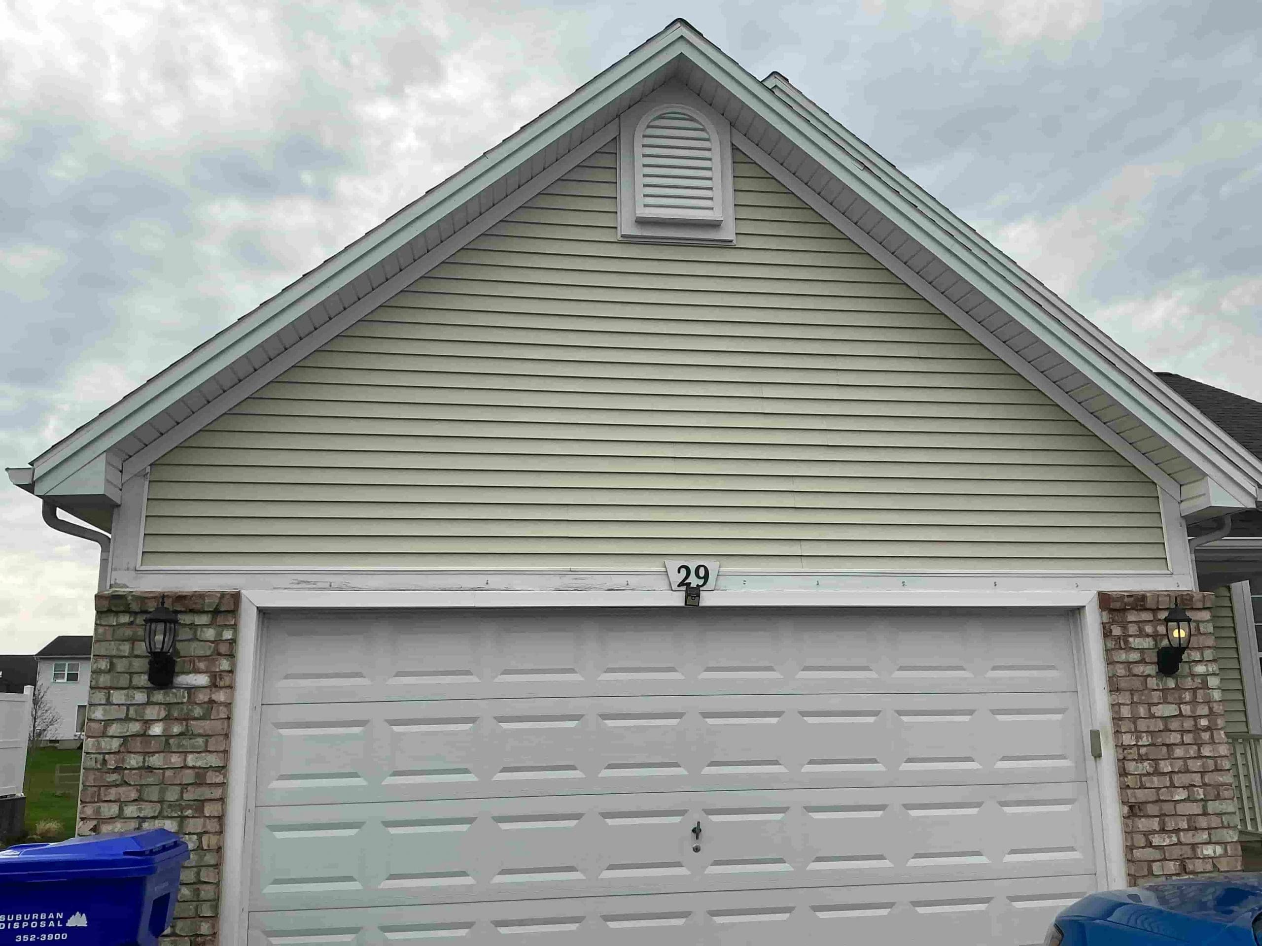 freshly painted siding on Rochester suburban home
