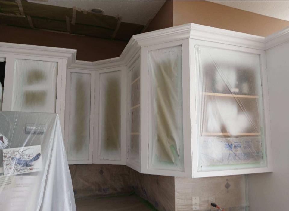 white kitchen cabinets professionally painted in Buffalo home